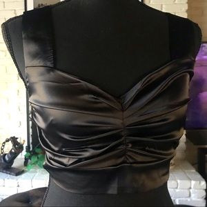 Black satin crop top with thick straps.